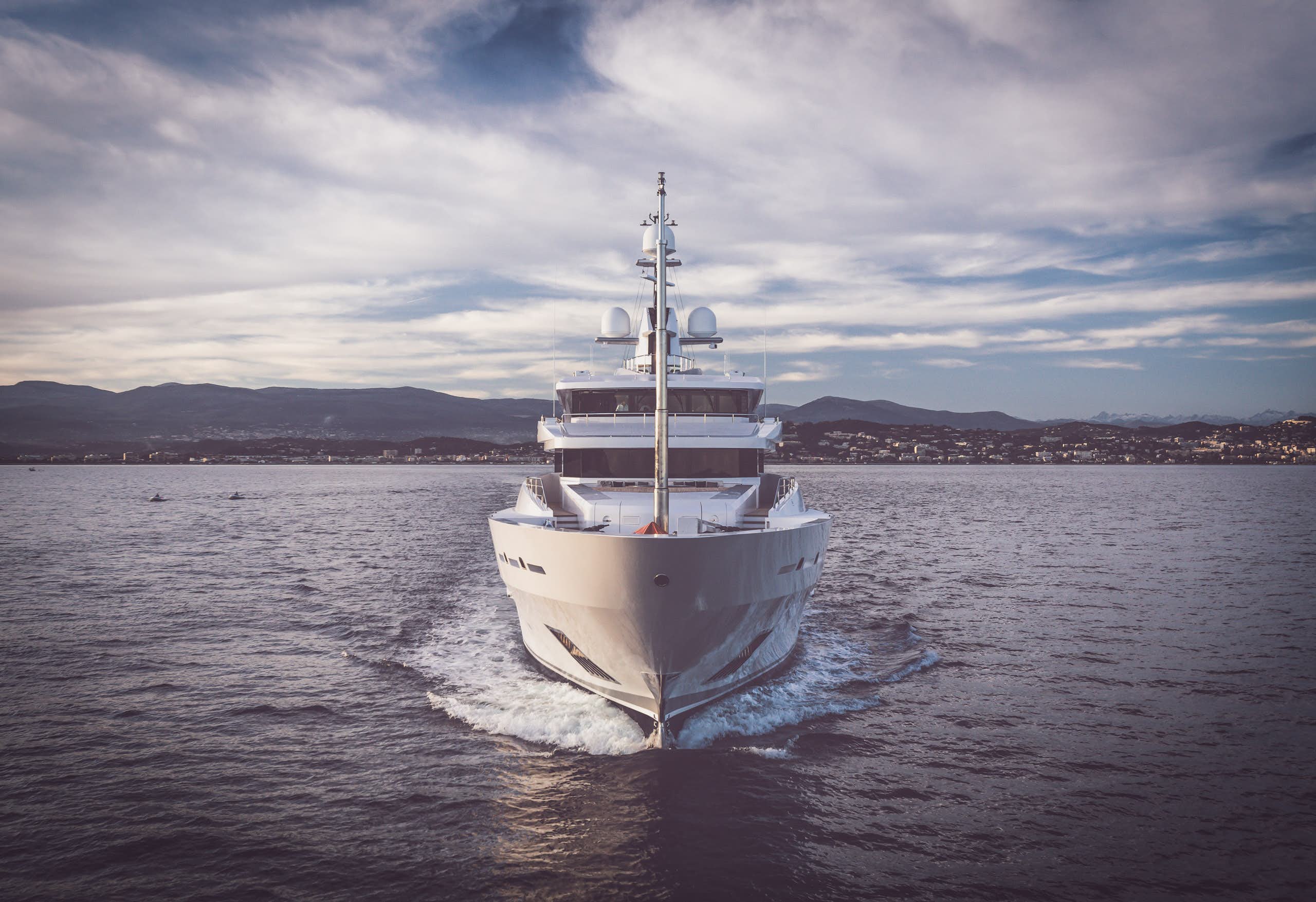 Superyacht cruising in the direction of the camera