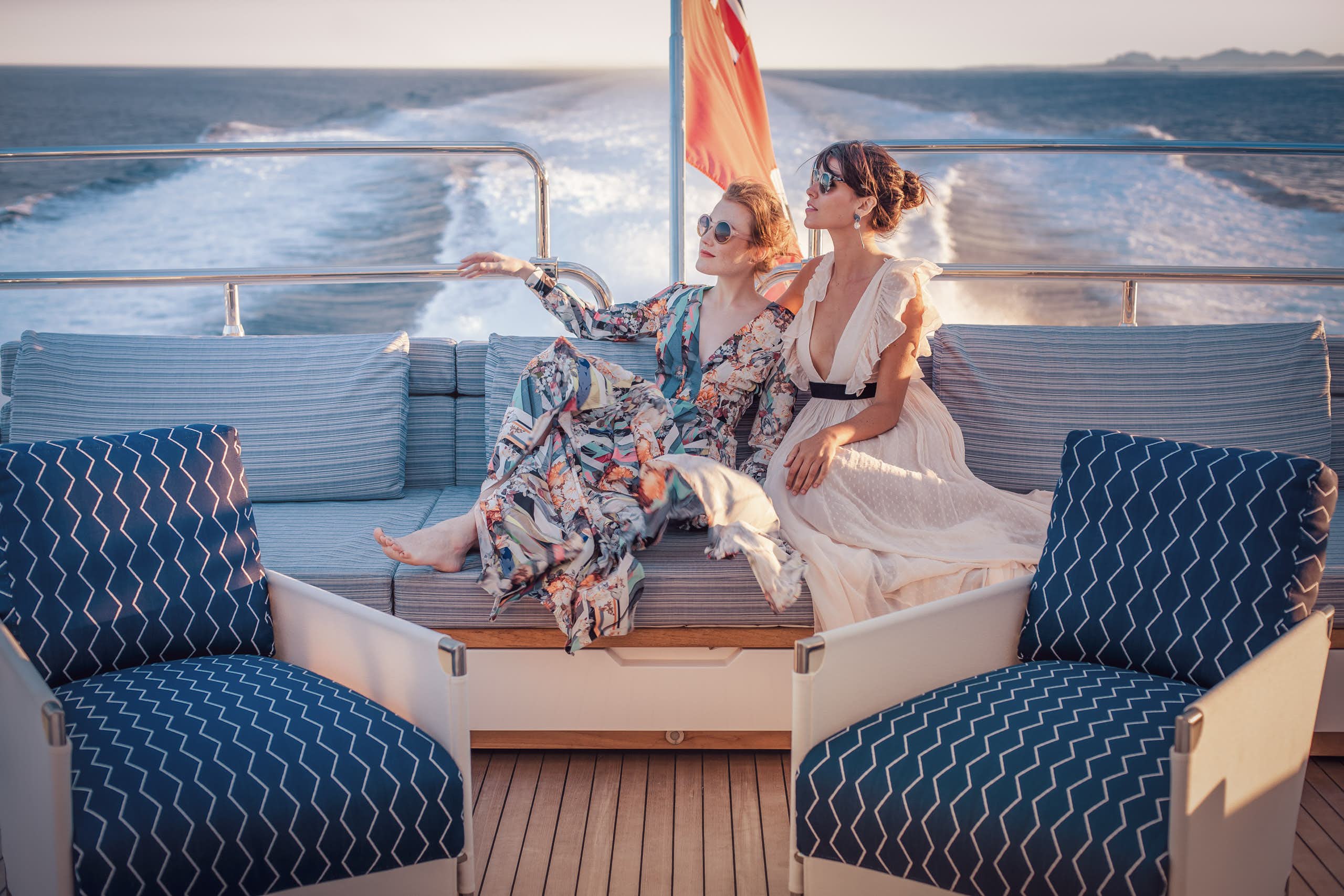 Two women sitting on the sundeck while underway